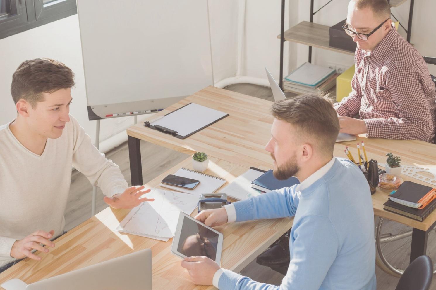 Professional discussing budget planning strategies with detailed charts